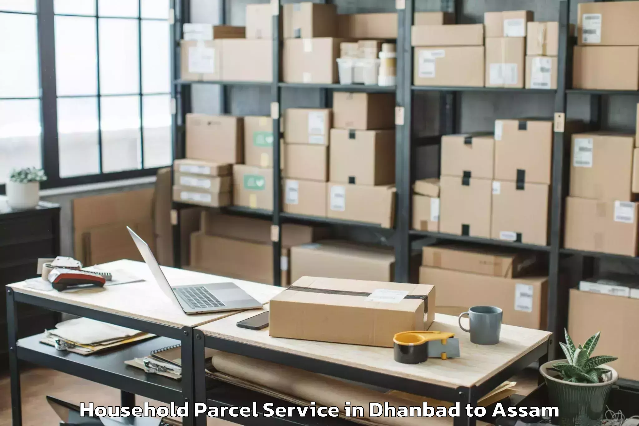 Book Your Dhanbad to Lakhipur Household Parcel Today